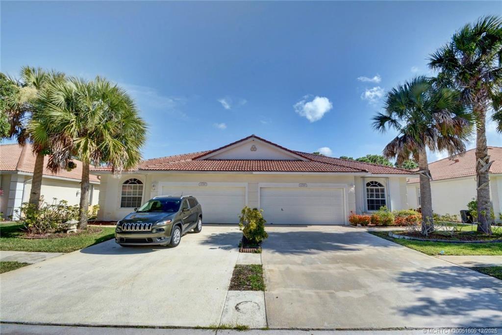 6789 Southeast Warwick Lane Stuart, FL 34997 - Photo 21 of 24 a view of a house with a patio
