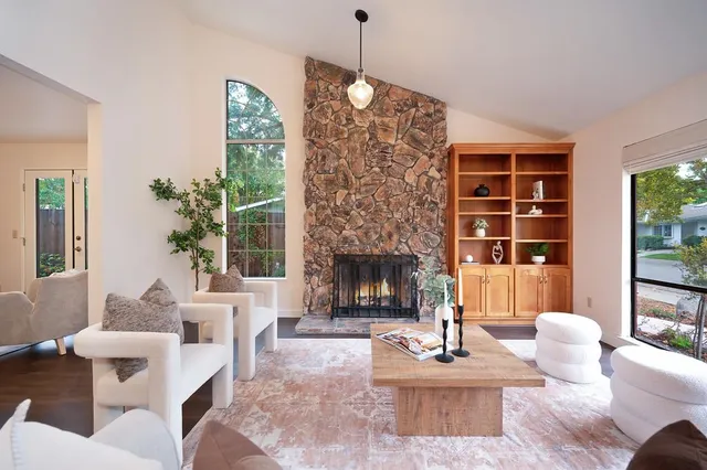 a kitchen with granite countertop wooden cabinets stainless steel appliances a sink and a window