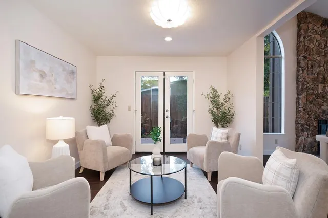 a kitchen with granite countertop wooden cabinets and white appliances