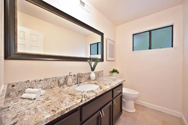 a view of a house with swimming pool and sitting area