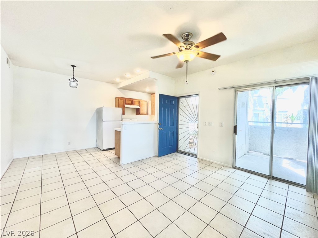2201 Ramsgate Drive, Unit 915 Henderson, NV 89074 - Photo 15 of 36 Functional kitchen with tile floors and ample space.