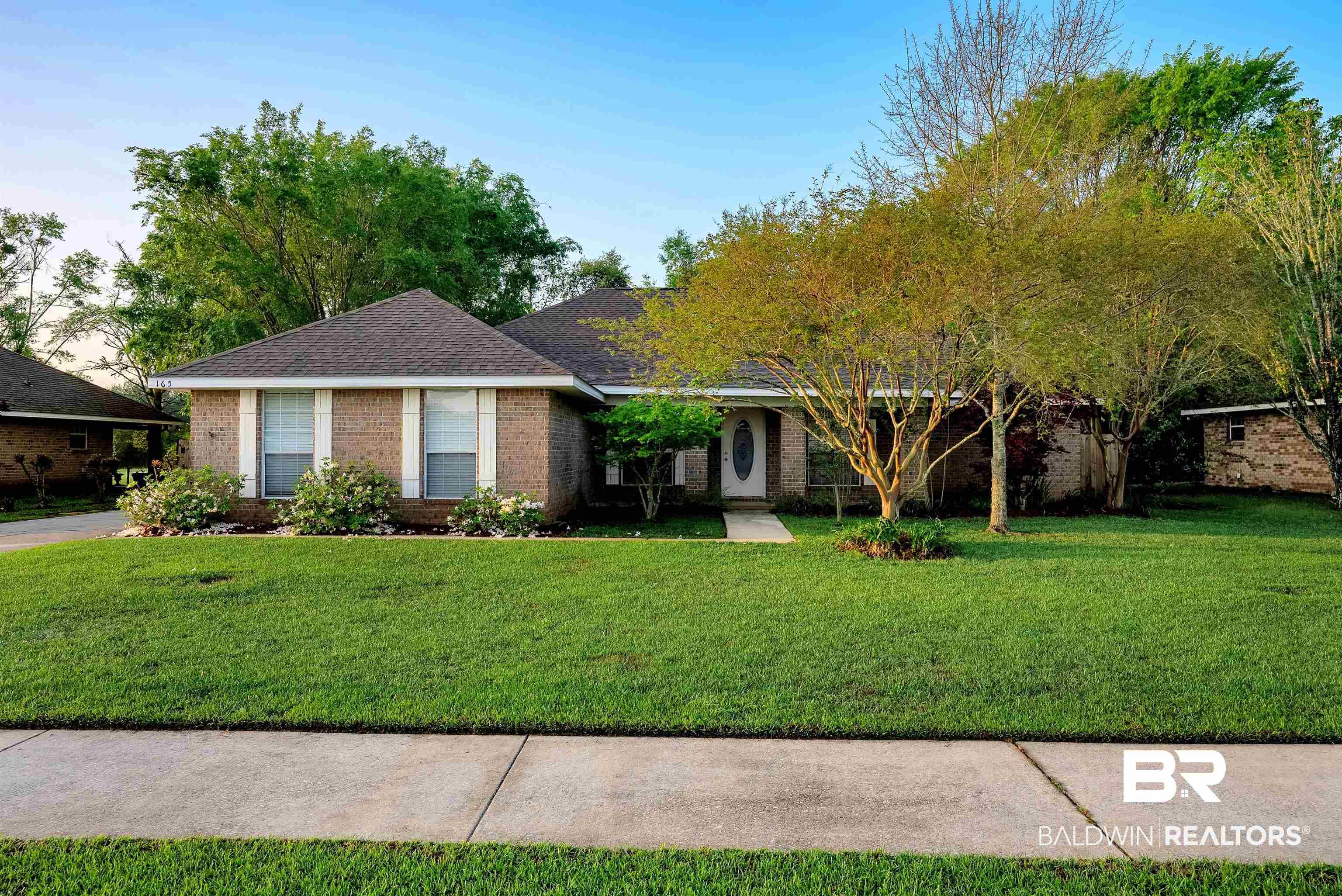 165 Pemberton Loop Fairhope, AL 36532 - Photo 1 of 25 Ranch-style home with brick siding, roof with shingles, and a front lawn