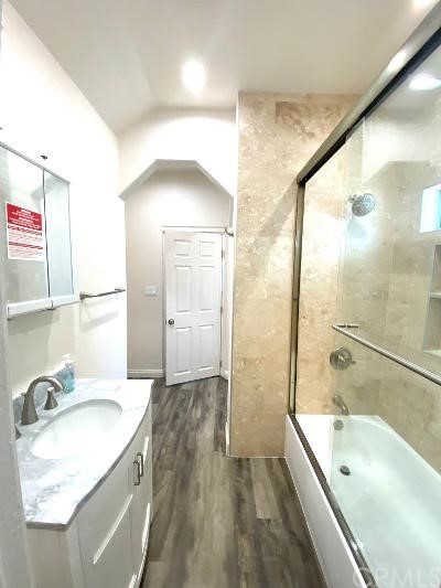 359 West Street, Unit A Upland, CA 91786 - Photo 11 of 24 a bathroom with a tub a sink and a large mirror