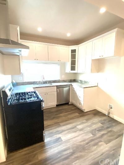 359 West Street, Unit A Upland, CA 91786 - Photo 14 of 24 a kitchen with a stove a sink and a refrigerator
