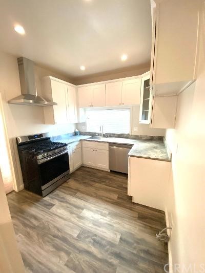 359 West Street, Unit A Upland, CA 91786 - Photo 19 of 24 a kitchen with a sink stove and cabinets