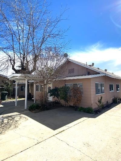 359 West Street, Unit A Upland, CA 91786 - Photo 22 of 24 a front view of a house with a yard and garage