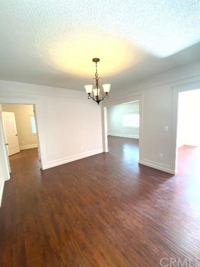 359 West Street, Unit A Upland, CA 91786 - Photo 3 of 24 a view of a livingroom with wooden floor and a ceiling fan
