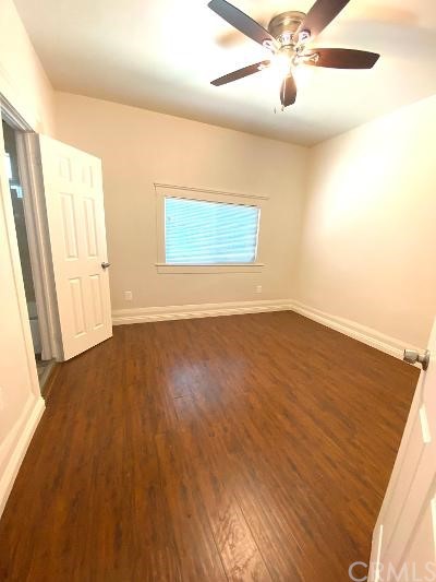 359 West Street, Unit A Upland, CA 91786 - Photo 7 of 24 wooden floor in an empty room with a window