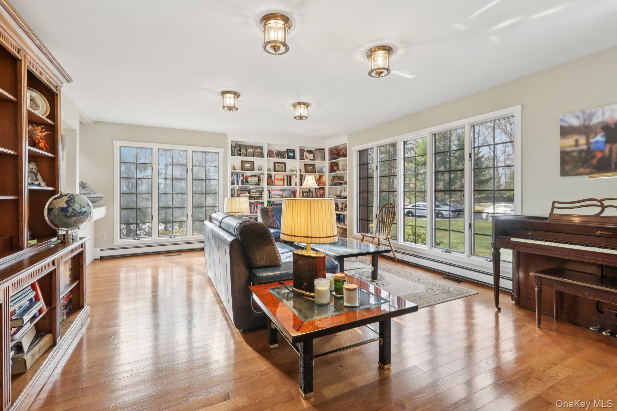 27 Cat Ridge Road North Salem, NY 10560 - Photo 16 of 49 a living room with furniture and a floor to ceiling window