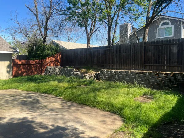 a backyard of a house with lots of green space