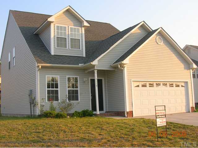 7116 Missionary Ridge Drive Raleigh, NC 27610 - Photo 1 of 12 a view of a house with a yard