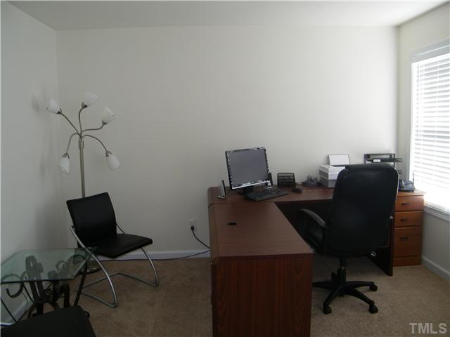 7116 Missionary Ridge Drive Raleigh, NC 27610 - Photo 11 of 12 a view of a workspace with furniture and a window