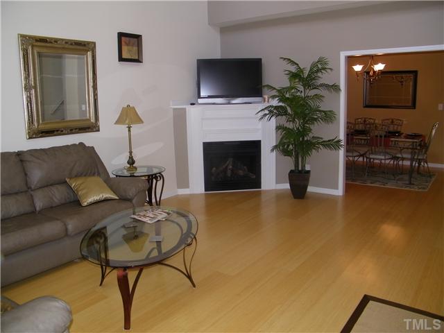 7116 Missionary Ridge Drive Raleigh, NC 27610 - Photo 4 of 12 a living room with furniture and a fireplace