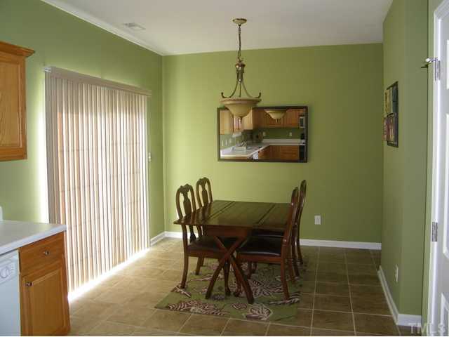 7116 Missionary Ridge Drive Raleigh, NC 27610 - Photo 7 of 12 a dining room with furniture and window