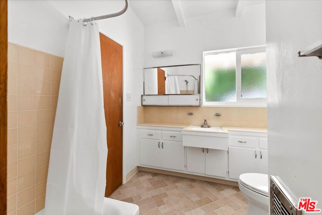 1012 Camann Street Glendale, CA 91208 - Photo 13 of 33 a bathroom with a sink a toilet and a mirror