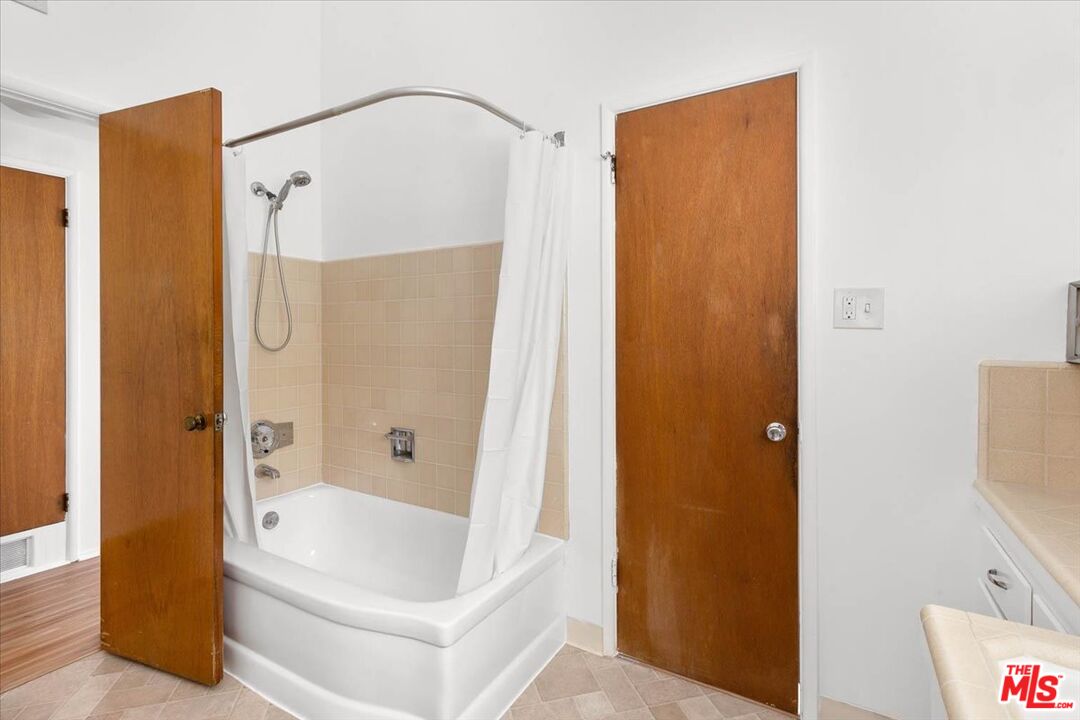 1012 Camann Street Glendale, CA 91208 - Photo 15 of 33 a bathroom with a bathtub and a shower