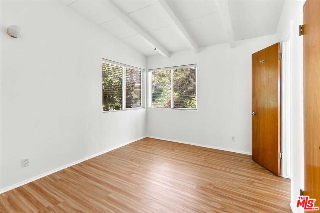 1012 Camann Street Glendale, CA 91208 - Photo 16 of 33 an empty room with wooden floor and windows