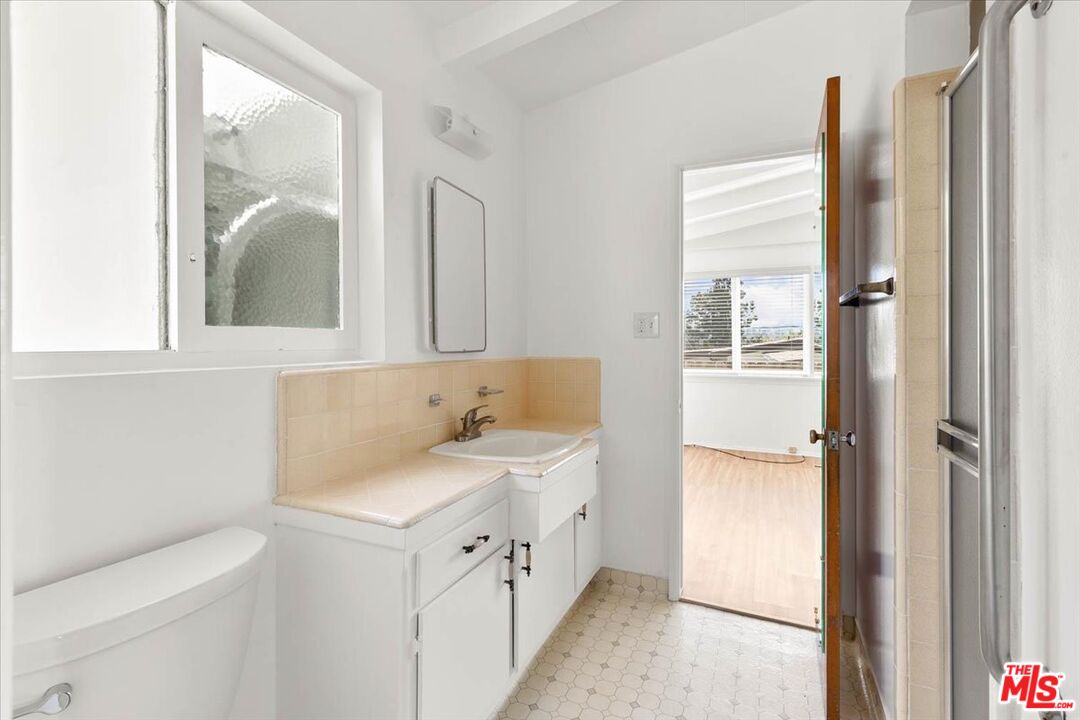 1012 Camann Street Glendale, CA 91208 - Photo 19 of 33 a bathroom with a sink and a mirror