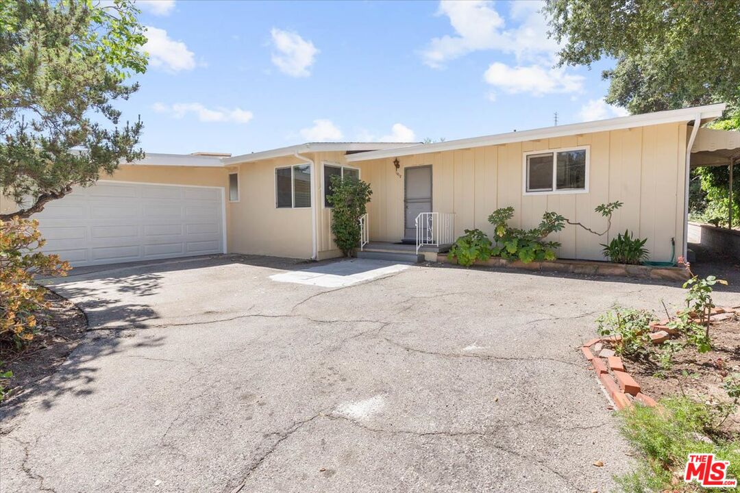 1012 Camann Street Glendale, CA 91208 - Photo 32 of 33 a front view of a house with a garden and potted plants