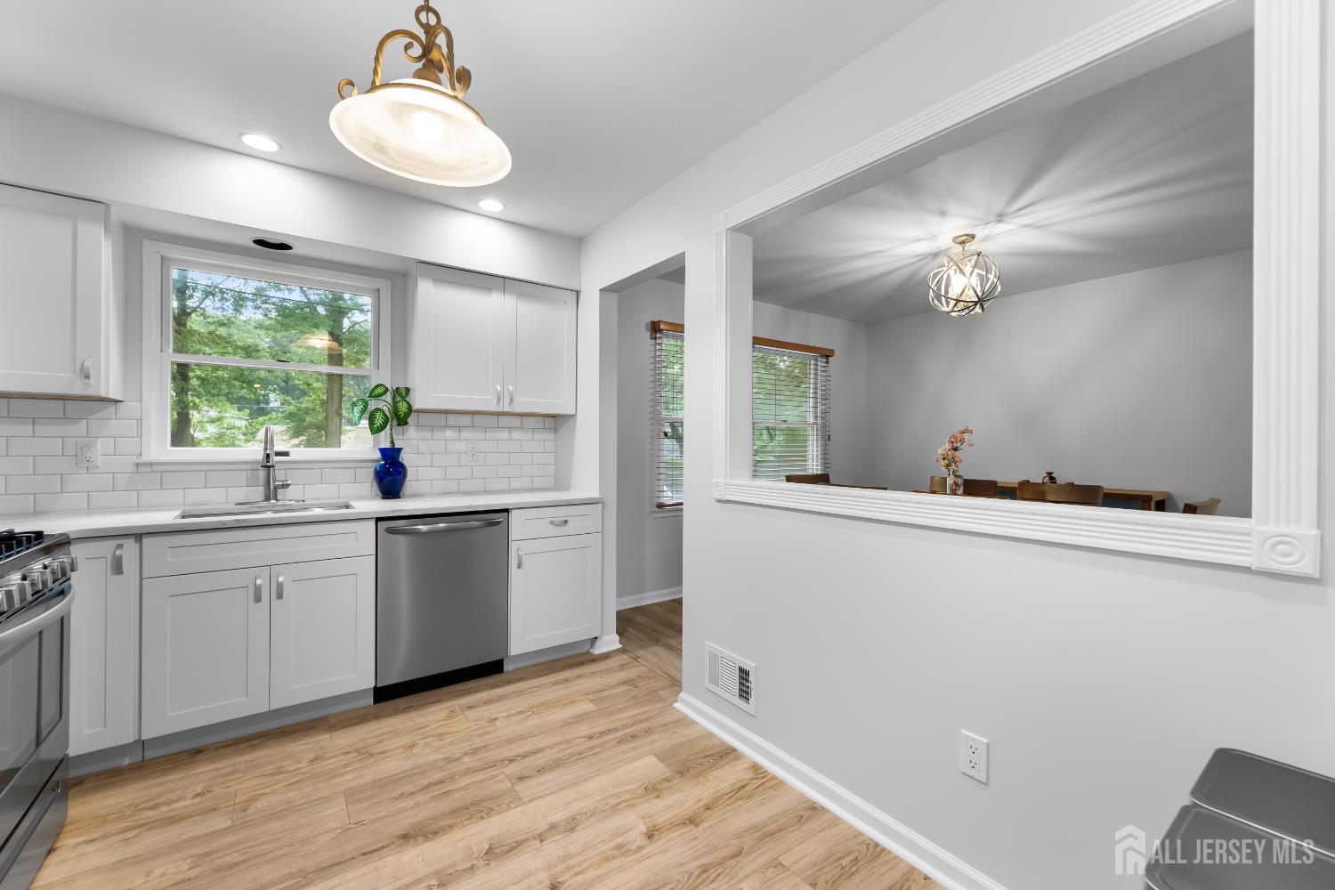 45 Kenmore Road Edison, NJ 08817 - Photo 12 of 43 a kitchen with a sink cabinets and window