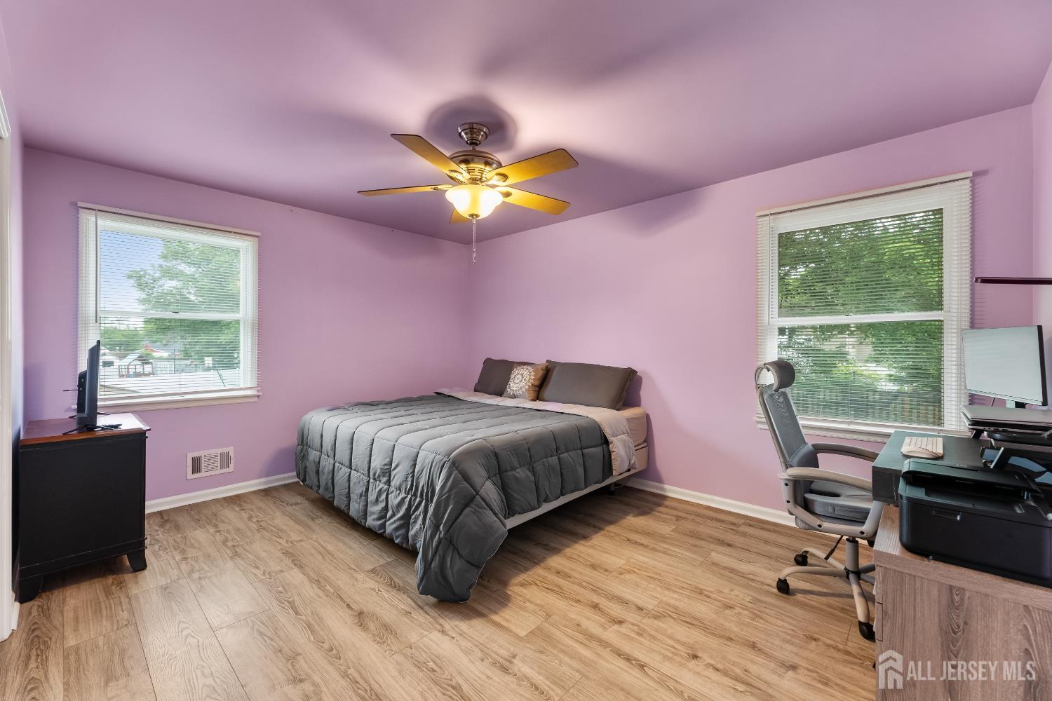45 Kenmore Road Edison, NJ 08817 - Photo 17 of 43 a bedroom with a bed table chair and a window