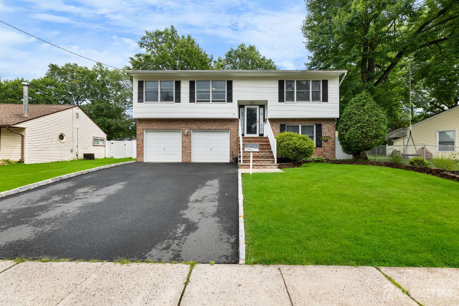 45 Kenmore Road Edison, NJ 08817 - Photo 2 of 43 front view of a house with a yard