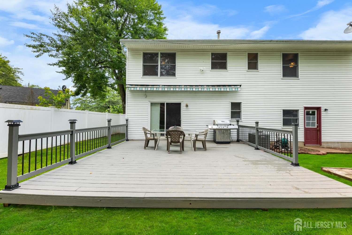 45 Kenmore Road Edison, NJ 08817 - Photo 28 of 43 a view of a patio with table and chairs and potted plants