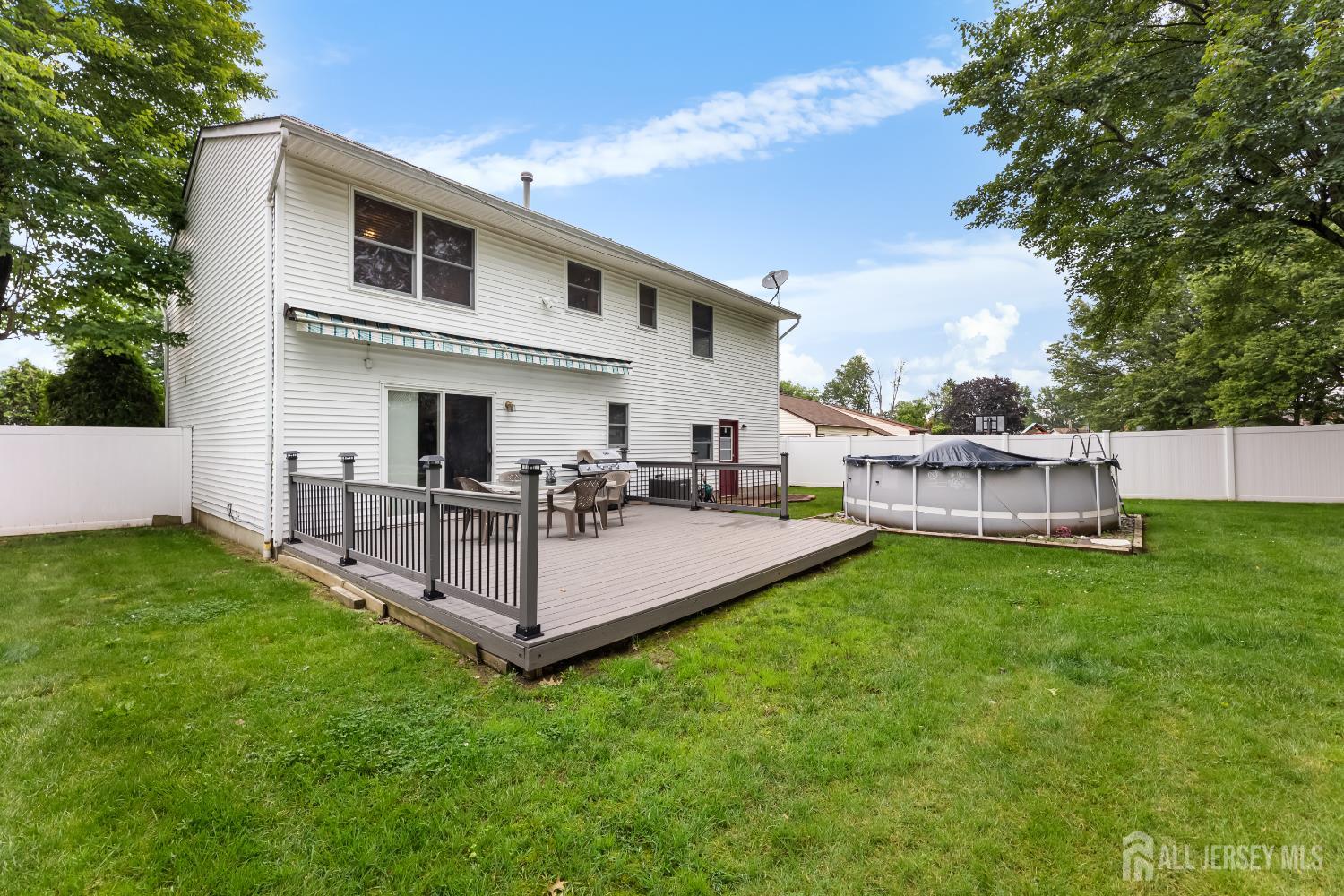 45 Kenmore Road Edison, NJ 08817 - Photo 30 of 43 a view of a house with a backyard and a garden