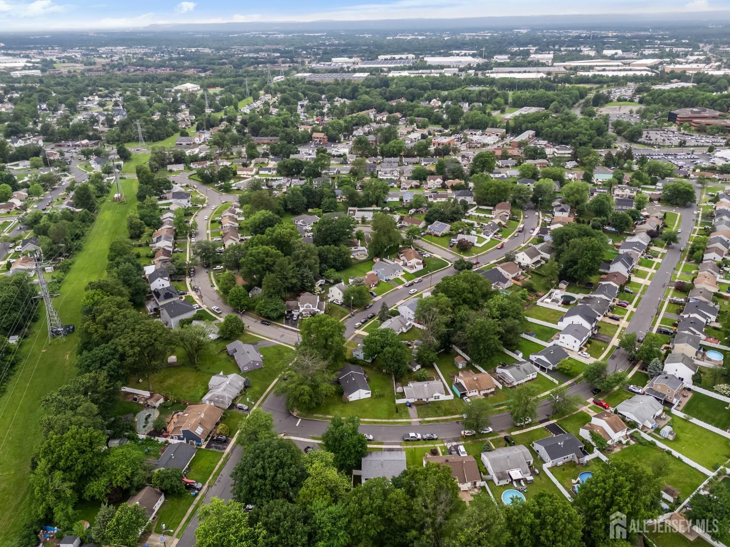 45 Kenmore Road Edison, NJ 08817 - Photo 39 of 43 an aerial view of residential houses with outdoor space and trees