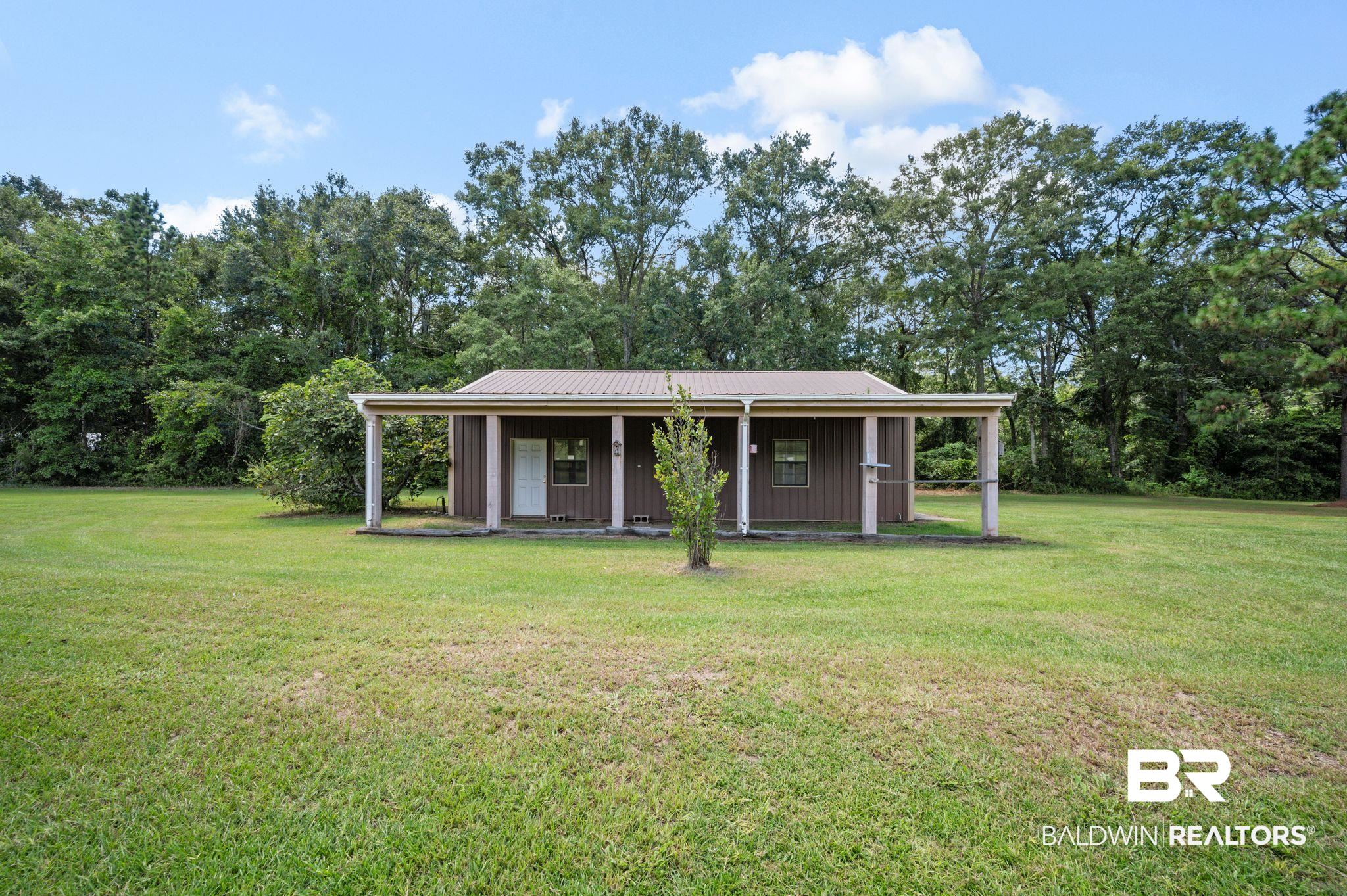 15880 Pine Grove Rd Extension West Bay Minette, AL 36507 - Photo 15 of 44 View of front of house featuring a front lawn