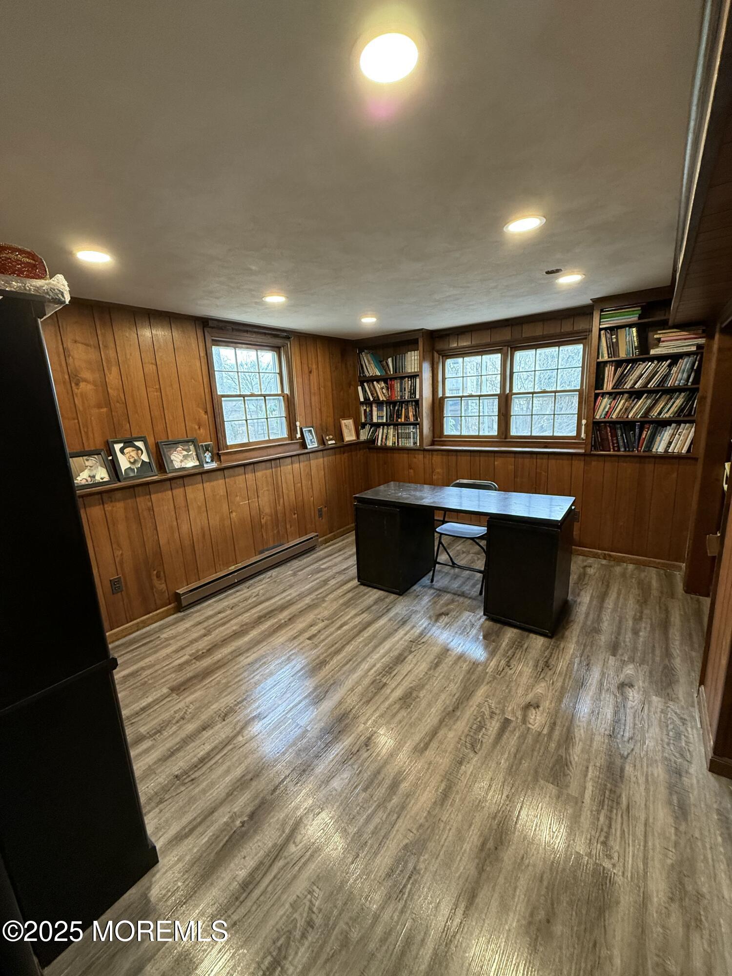 23 Hilltop Road West Long Branch, NJ 07764 - Photo 8 of 10 a room with wooden floor and furniture