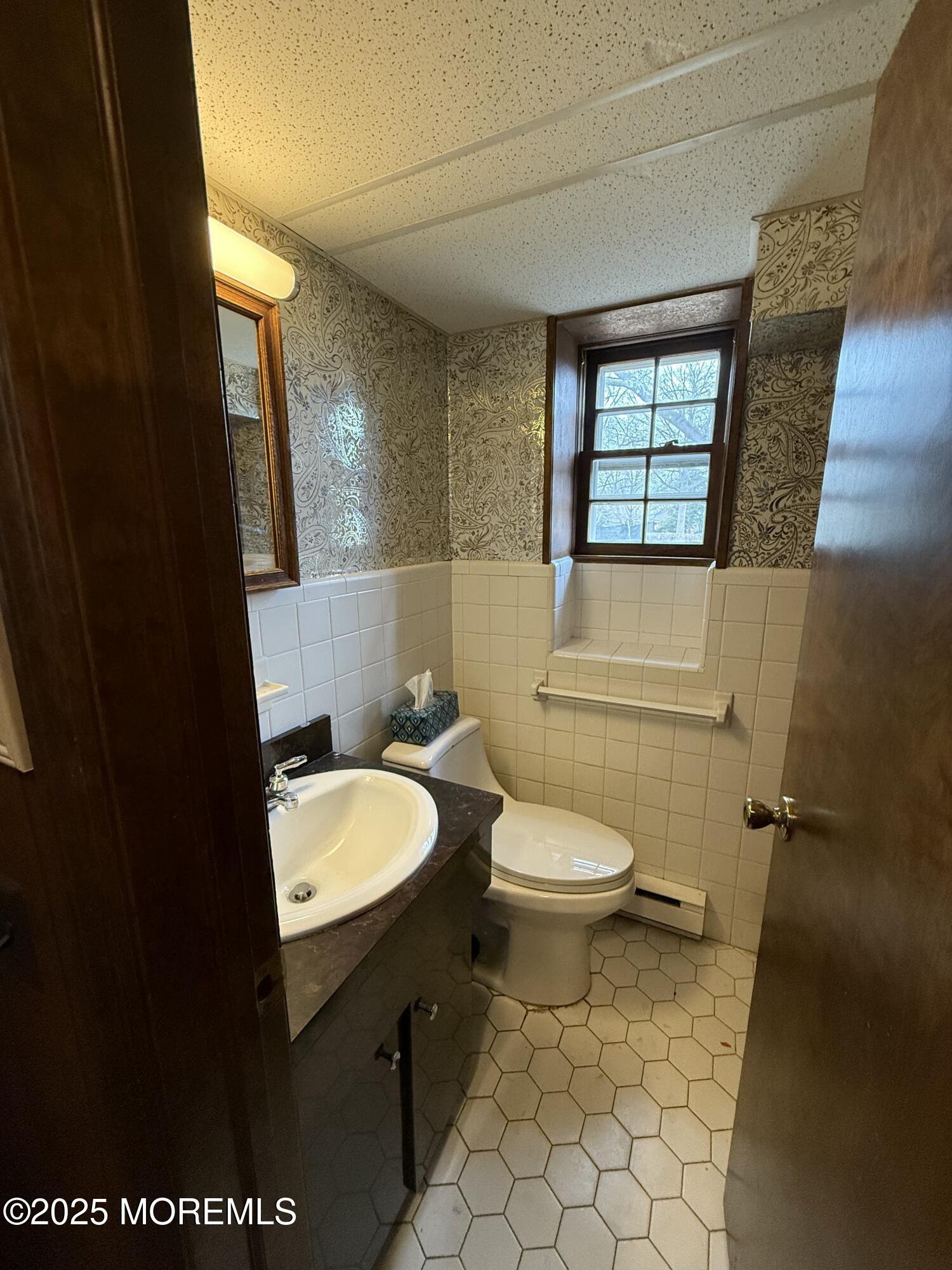 23 Hilltop Road West Long Branch, NJ 07764 - Photo 10 of 10 a bathroom with a toilet a sink and a mirror