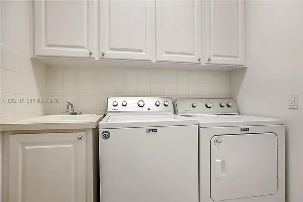 a utility room with dryer and washer