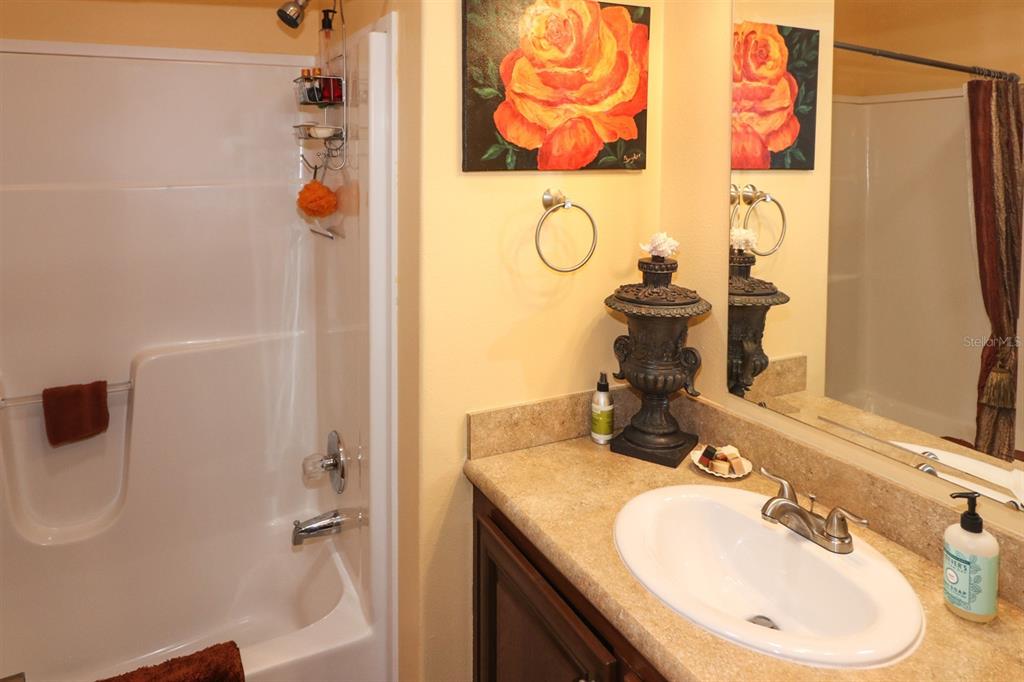 29200 South Jones Loop Road, Unit 715 Punta Gorda, FL 33950 - Photo 11 of 37 a bathroom with a sink and a mirror