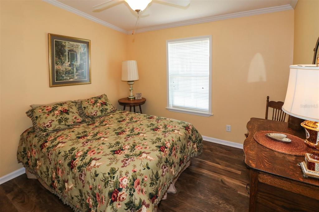 29200 South Jones Loop Road, Unit 715 Punta Gorda, FL 33950 - Photo 13 of 37 a bed sitting in a bedroom next to a window