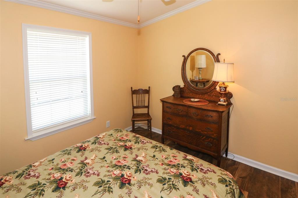 29200 South Jones Loop Road, Unit 715 Punta Gorda, FL 33950 - Photo 14 of 37 a bedroom with a bed and a dresser