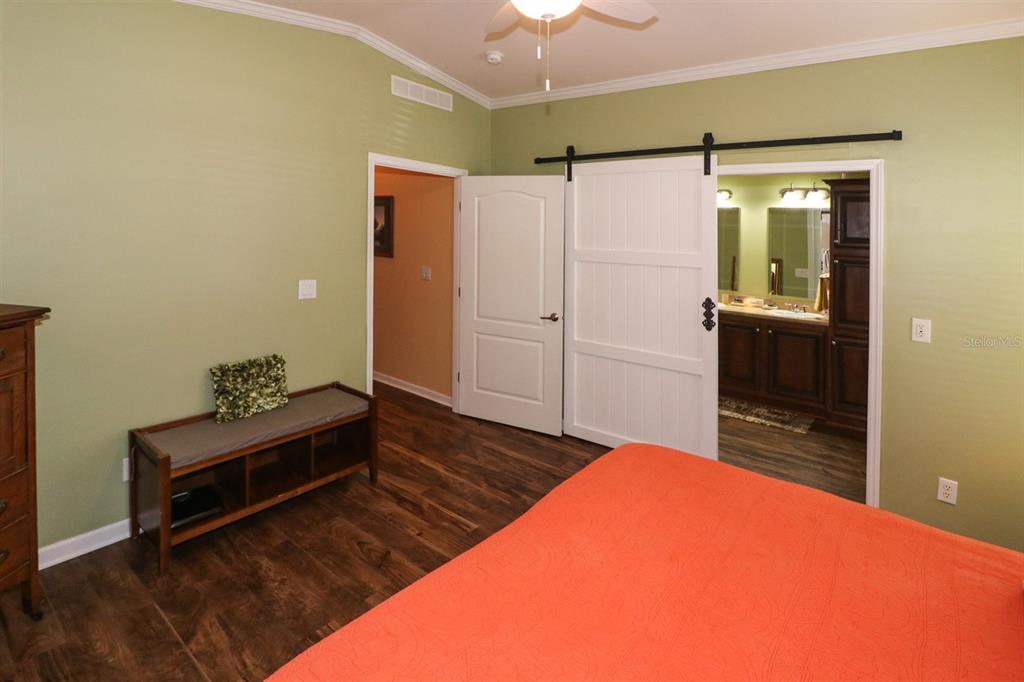 29200 South Jones Loop Road, Unit 715 Punta Gorda, FL 33950 - Photo 16 of 37 a bedroom with a bed and a dresser