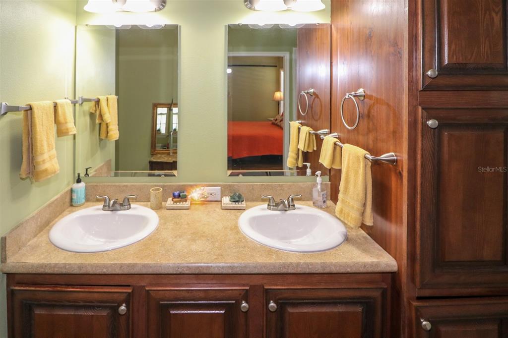 29200 South Jones Loop Road, Unit 715 Punta Gorda, FL 33950 - Photo 17 of 37 a bathroom with a sink and a mirror