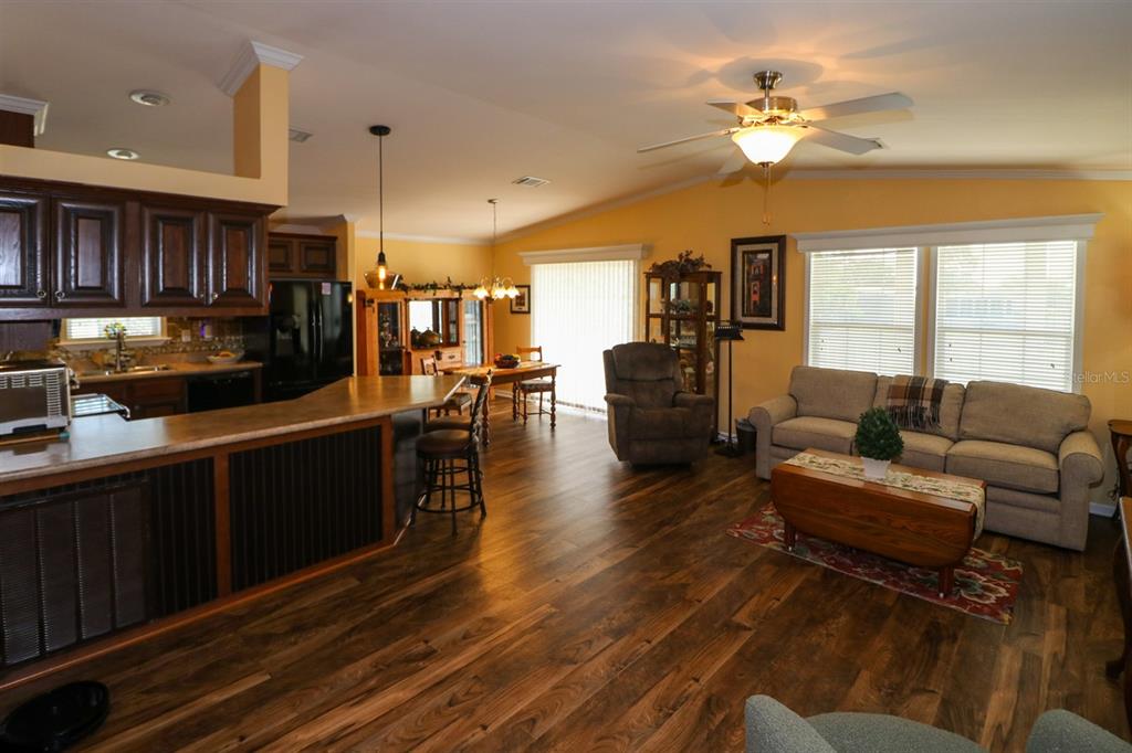 29200 South Jones Loop Road, Unit 715 Punta Gorda, FL 33950 - Photo 21 of 37 a living room with furniture kitchen view and a large window