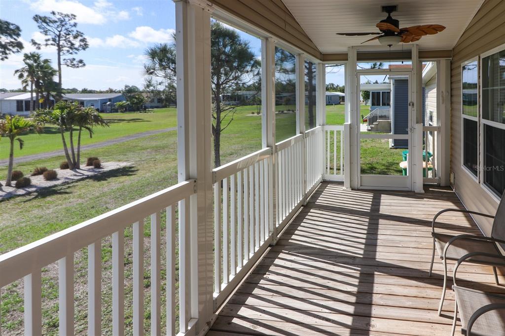 29200 South Jones Loop Road, Unit 715 Punta Gorda, FL 33950 - Photo 29 of 37 a view of a porch with wooden floor and fence