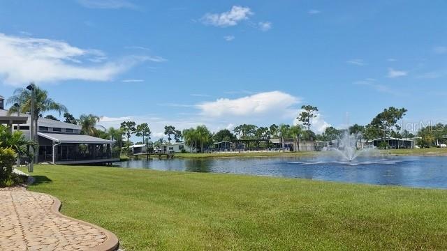 29200 South Jones Loop Road, Unit 715 Punta Gorda, FL 33950 - Photo 35 of 37 a view of a lake with houses