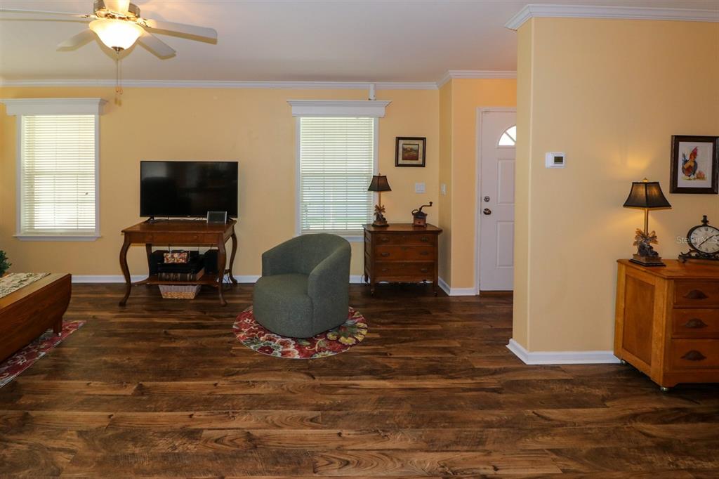 29200 South Jones Loop Road, Unit 715 Punta Gorda, FL 33950 - Photo 6 of 37 a living room with furniture and a flat screen tv