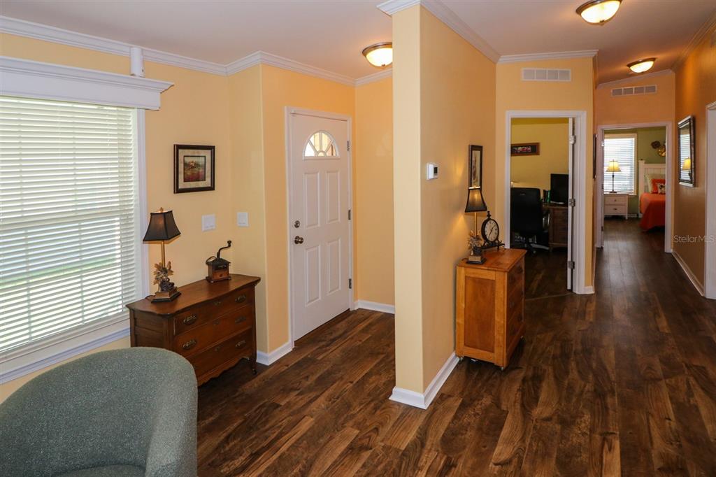 29200 South Jones Loop Road, Unit 715 Punta Gorda, FL 33950 - Photo 7 of 37 a view of a livingroom with furniture and hardwood floor