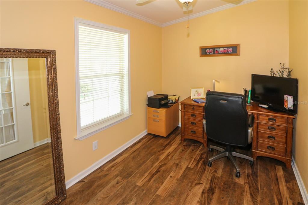 29200 South Jones Loop Road, Unit 715 Punta Gorda, FL 33950 - Photo 8 of 37 a view of a workspace with furniture and a window
