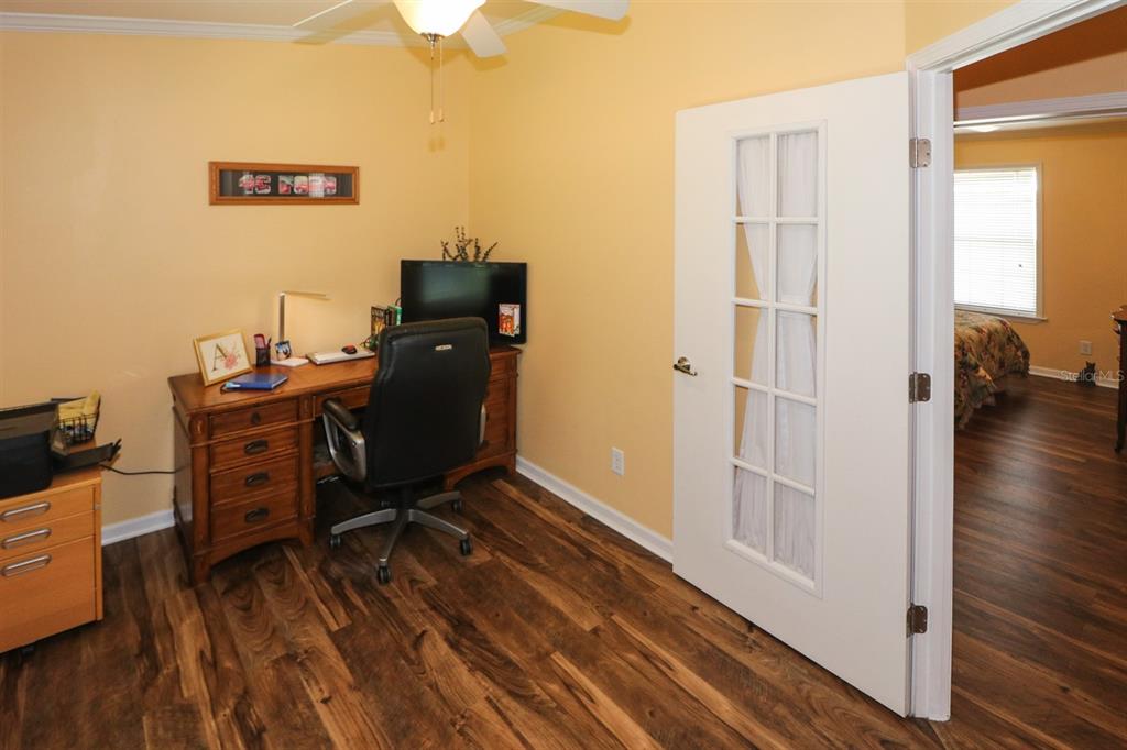29200 South Jones Loop Road, Unit 715 Punta Gorda, FL 33950 - Photo 10 of 37 a view of a workspace with furniture and wooden floor