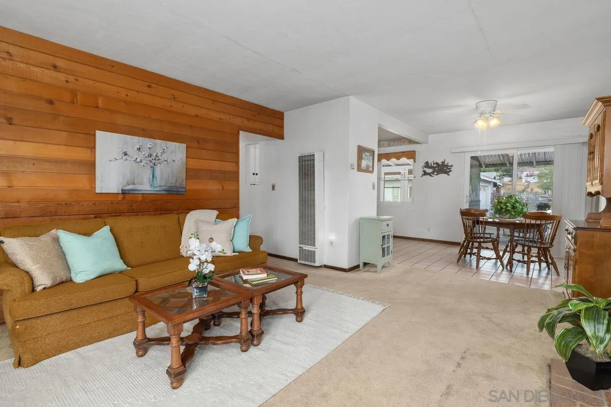 11179 Topo Lane Lakeside, CA 92040 - Photo 11 of 44 a living room with furniture and a chair