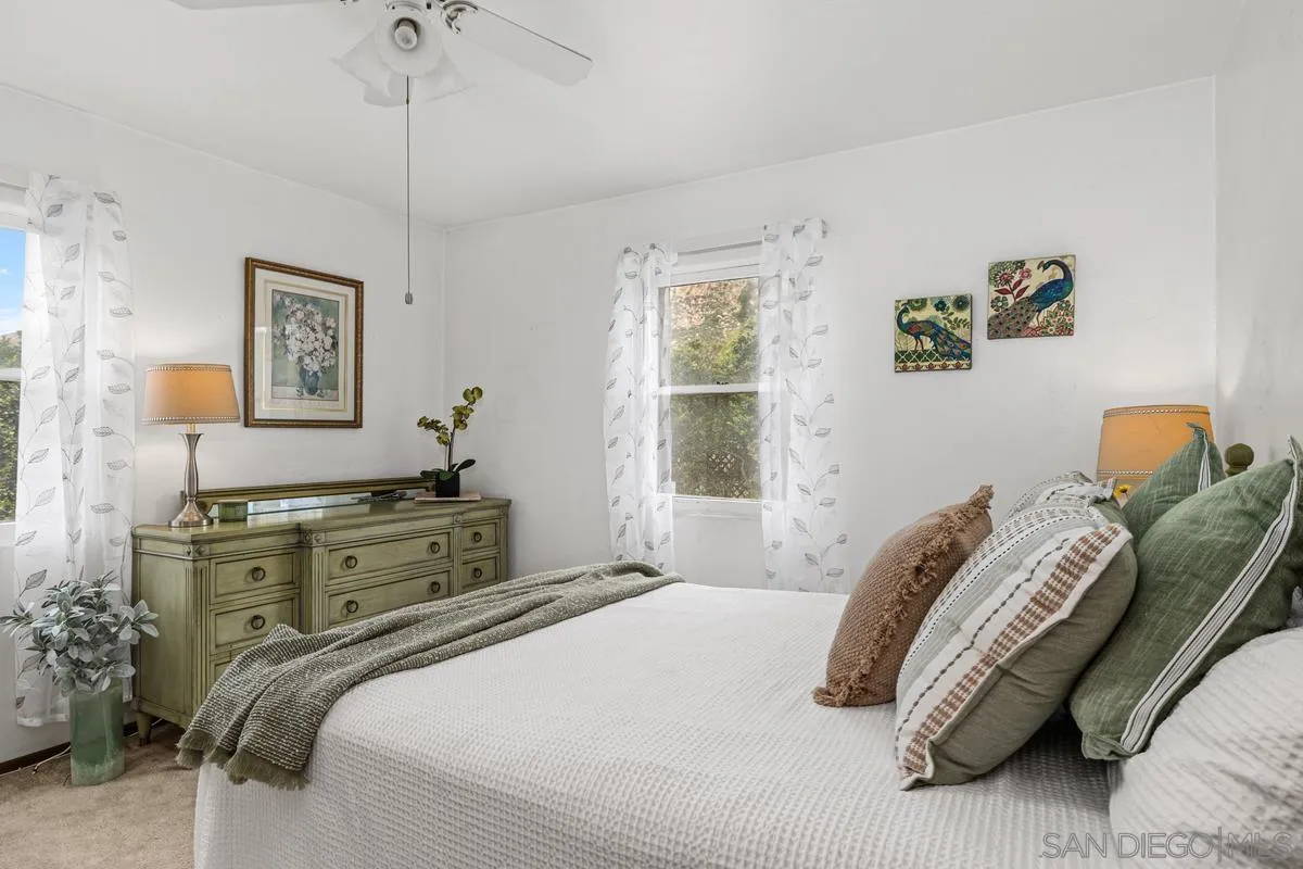 11179 Topo Lane Lakeside, CA 92040 - Photo 20 of 44 a bedroom with a bed and a window