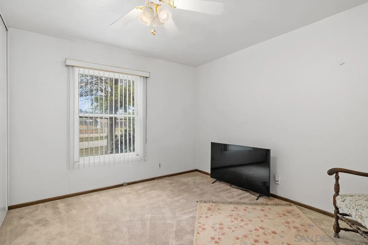 11179 Topo Lane Lakeside, CA 92040 - Photo 22 of 44 a bedroom with a bed and a window