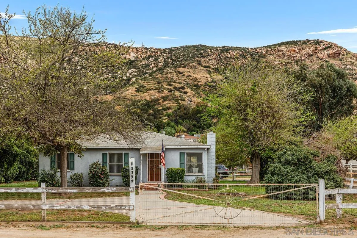 11179 Topo Lane Lakeside, CA 92040 - Photo 3 of 44 a view of a white house with a large tree