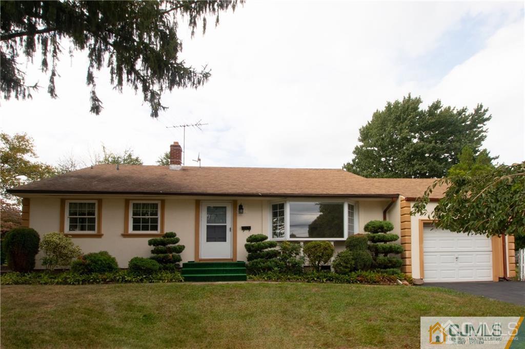 27 Eardley Road Edison, NJ 08817 - Photo 1 of 14 a front view of a house with a yard
